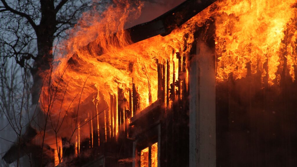 Burnt living room showing heavy fire and smoke damage in a BC home September 2025