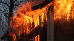Burnt living room showing heavy fire and smoke damage in a BC home September 2025