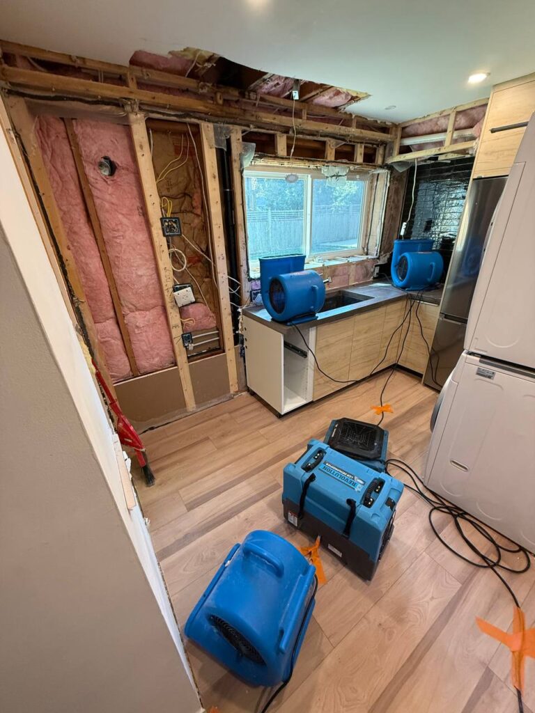 Ceiling water damage caused by roof leak in a Vancouver house