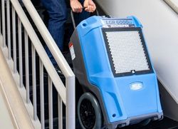 Commercial dehumidifier used for structural drying and moisture control in a water-damaged building