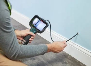 Inspection camera used to check hidden mold and moisture inside walls